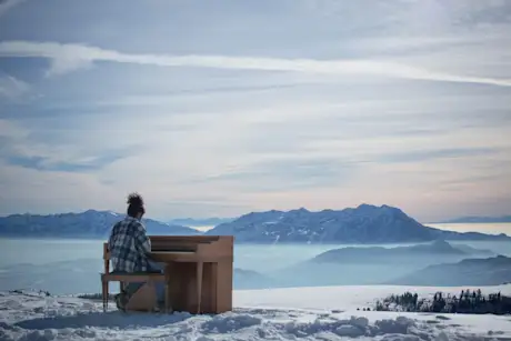 Candace Camacho playing piano on Powder Mountain 